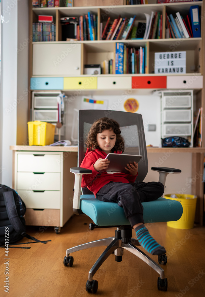 Three year old boy using a digital tablet Three year old boy using a digital tablet
