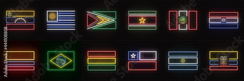A set of 12 flags of different South American countries, in neon style. On the background of a brick wall with a shadow. For decoration of tourist or patriotic themes. Isolated. Collection
