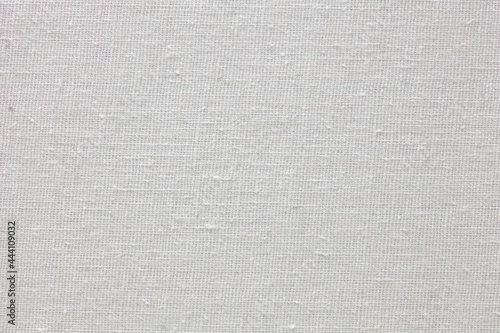 A neutral gray canvas texture (slightly aged). Anonymous backdrop. 