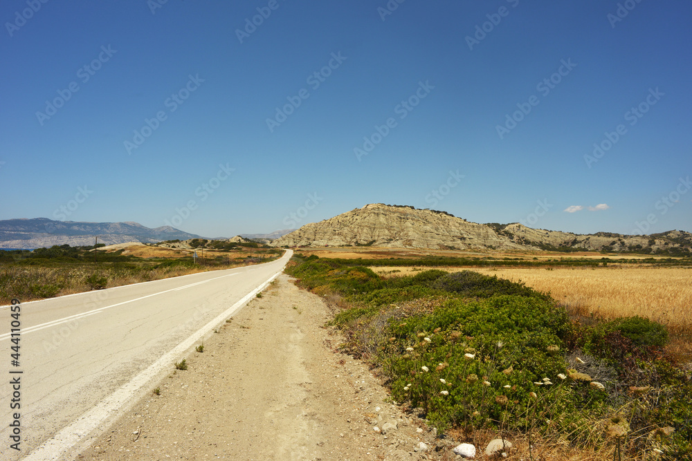 Lonely road in southern Rhodes island, Greece
