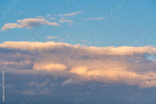 orange sunset sky with lighted clouds