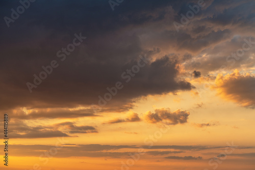 orange sunset sky with lighted clouds