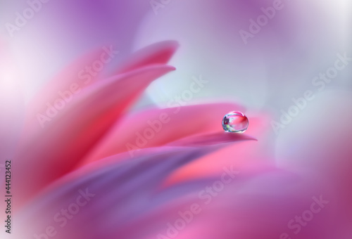Beautiful macro shot of magic flowers.Border art design. Magic light.Extreme close up photography.Conceptual abstract image.Violet and Pink Background.Fantasy Art.Creative Wallpaper.Water Drop.