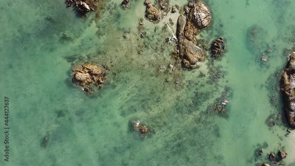 Aerial down view of waves over beautiful rocks by the beach in Langkawi Malaysia Aerial down view of waves over beautiful rocks by the beach in Langkawi Malaysia