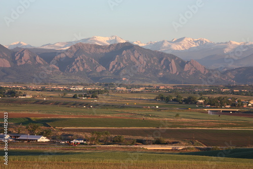 Colorado front range of the rocky mountains and Boulder FlatIrons  as seen  at sunrise in early summer from Broomfield, Colorado  photo