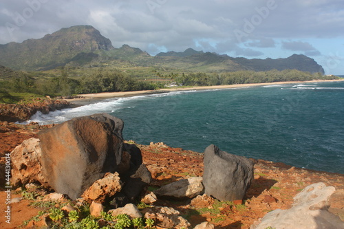  Spectacularly-eroded coastline and surf at mahaulepu beach along the heritage trail in poipu, kauai, Hawaii photo