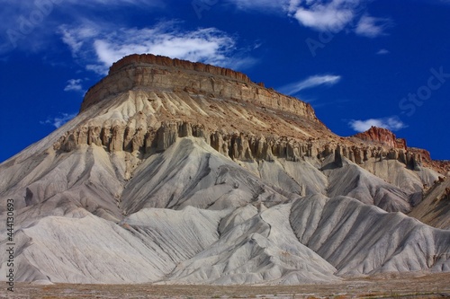the dramatically-eroded cliffs  of mount garfield against a blue sky, grand junction, colorado photo