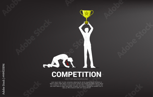 silhouette of winner with trophy and loser on knee. business concept for people in competition