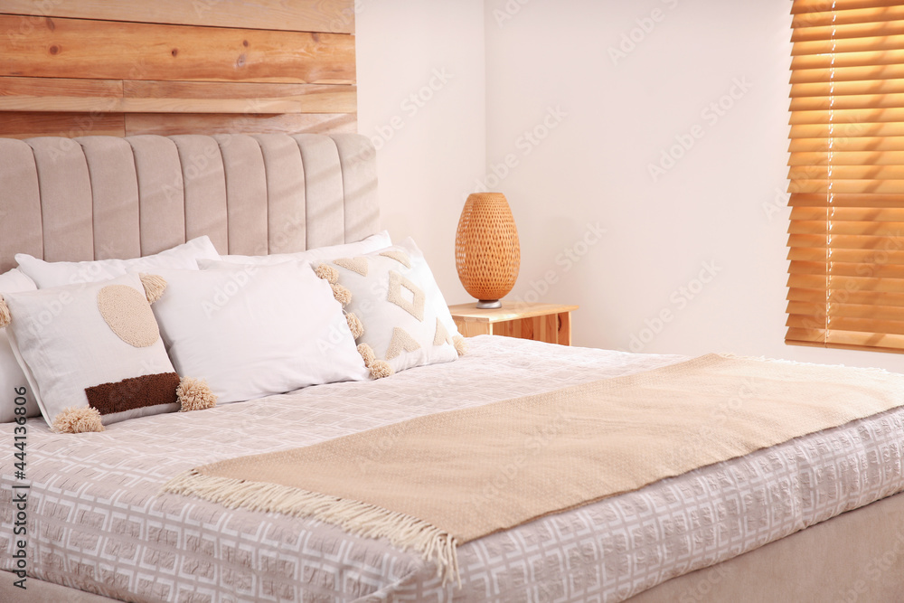 Fototapeta premium Stylish hotel room interior with comfortable bed