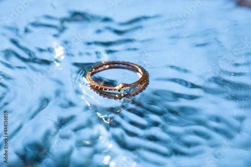 ring in water. Drops. Golden ring. 