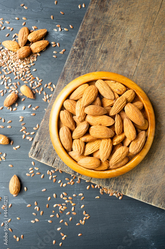 Almonds and flax seed over cutting board