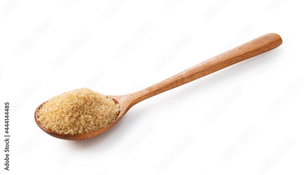 Wooden spoon and brown sugar placed on a white background. Wooden spoon and brown sugar placed on a white background.