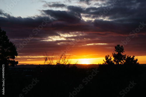 Sunsets on horizon over land