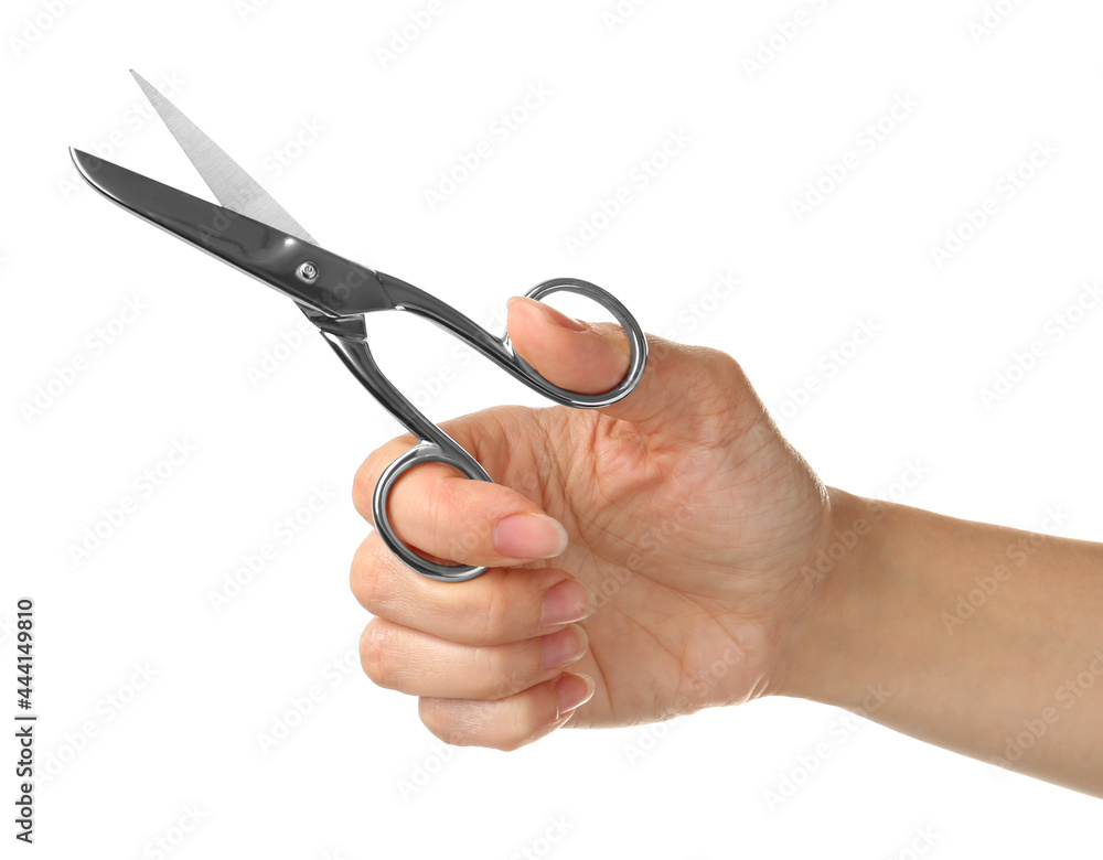 Woman holding sewing scissors isolated on white, closeup Woman holding sewing scissors isolated on white, closeup