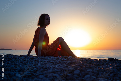 silhouette woman on the beach at sunset © Елена Дорнгоф