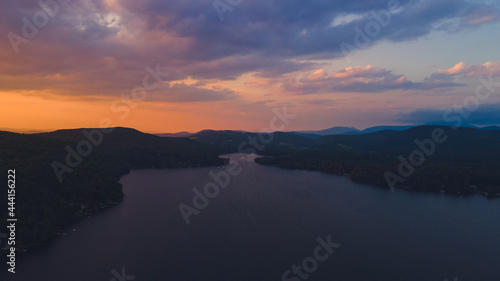 Sunset over the lake with colorful clouds