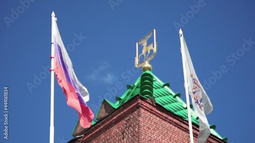 Dmitrievskaya Tower With Flags Waving. Main Tower On The Southern Wall Of The Nizhny Novgorod Kremlin In Russia. low angle photo