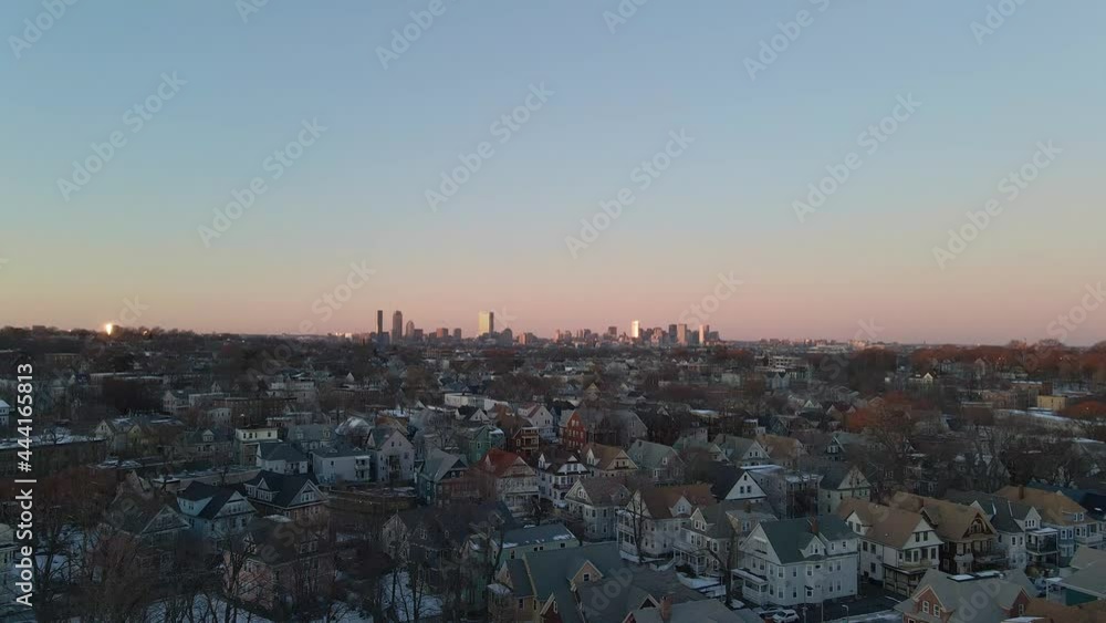Areal view of Boston neighborhood, with the downtown skyline in the distant background as the camera dolly's down. Areal view of Boston neighborhood, with the downtown skyline in the distant background as the camera dolly's down.