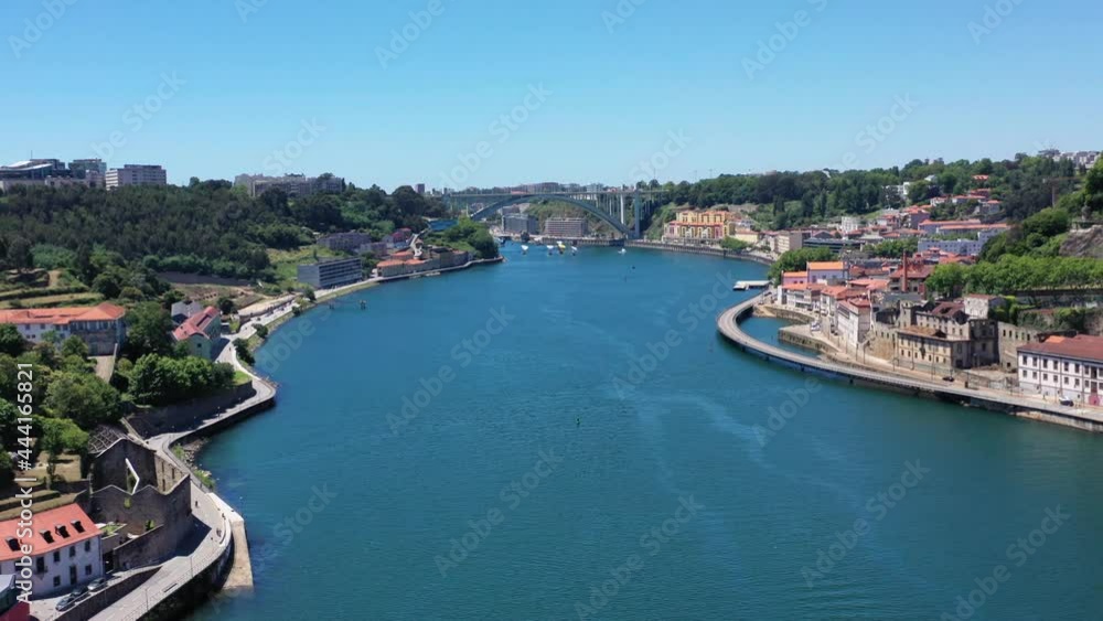 Scenic View Of The Porto Douro River Approaching Arrabida Bridge In Portugal - aerial shot Scenic View Of The Porto Douro River Approaching Arrabida Bridge In Portugal - aerial shot