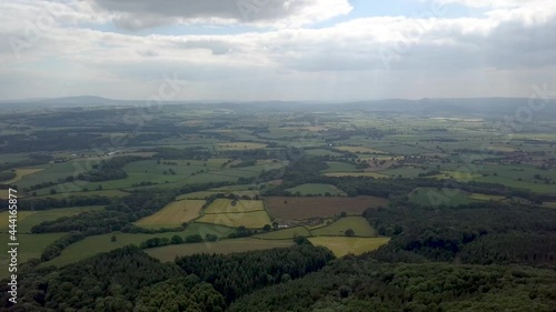 The Wrekin Hill in Sunny Shropshire. The Wrekin in beautiful Shropshire via drone. Shropshire hills aerial view with green fields, rocks and countryside. photo