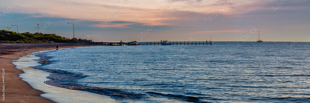 Sunset at Long Point Jetty with people fishing and swimming, Port Kennedy