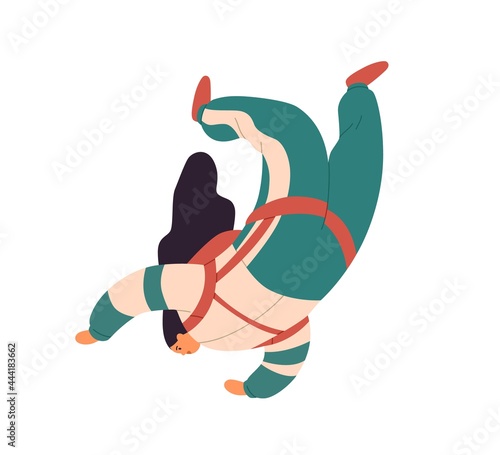 Woman falling down during skydiving jump. Skyjumper flying and floating in ai...