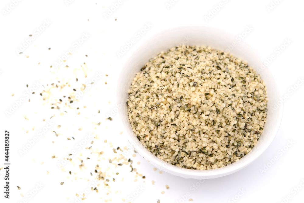 Organic shelled hemp seeds isolated on white background. Organic shelled hemp seeds isolated on white background.