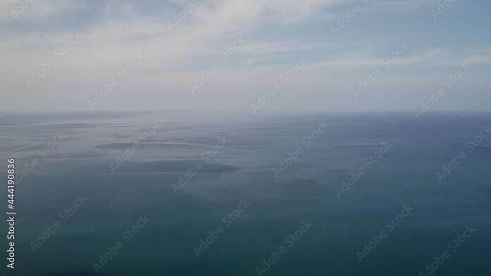 Beautiful Sea surface in summer season clouds and blue sky footage from drone aerial view High quality footage from drone camera Beautiful Sea surface in summer season clouds and blue sky footage from drone aerial view High quality footage from drone camera