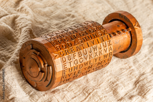 Opened bronze cryptex invented by Leonardo da Vinci from the book da vinci code. Word creativity as password set by letters rings. Cryptographic equipment printed on a 3D printer.