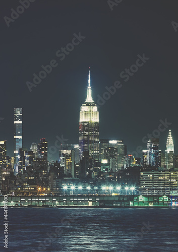 Manhattan skyline at night  color toning applied  New York City  USA.