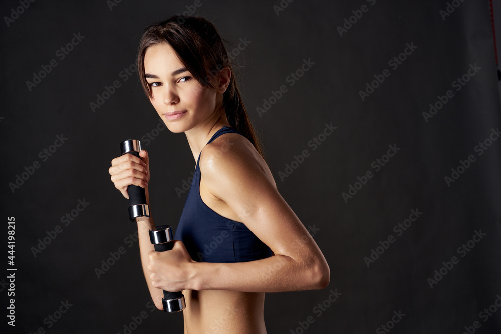 sportive woman holding dumbbells in hands fitness gym exercise sportive woman holding dumbbells in hands fitness gym exercise