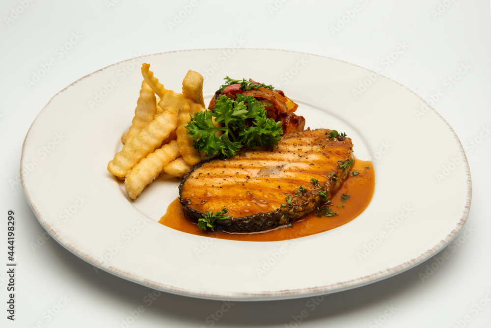 Grilled salmon with lemon and potato on background. Grilled salmon with lemon and potato on background.
