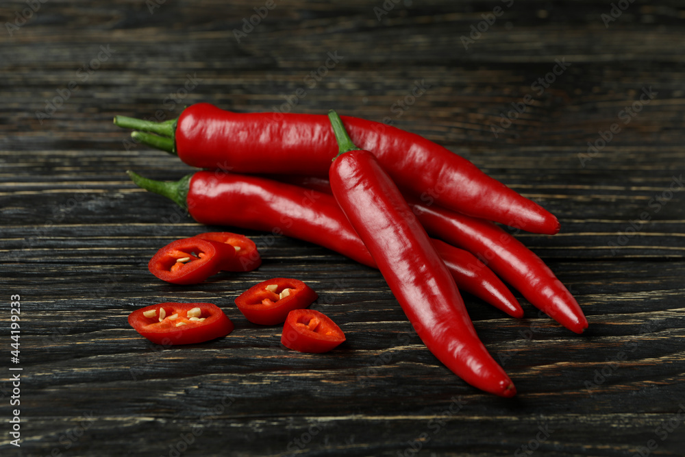 Red chili peppers on rustic wooden background
