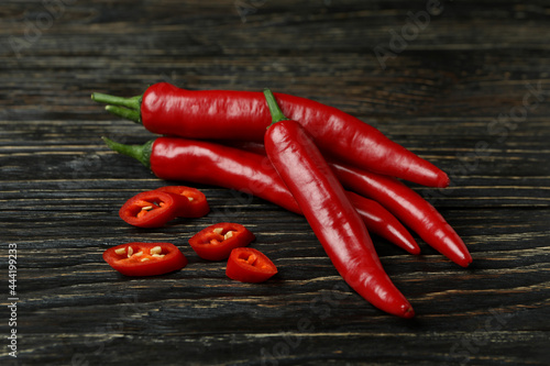 Red chili peppers on rustic wooden background