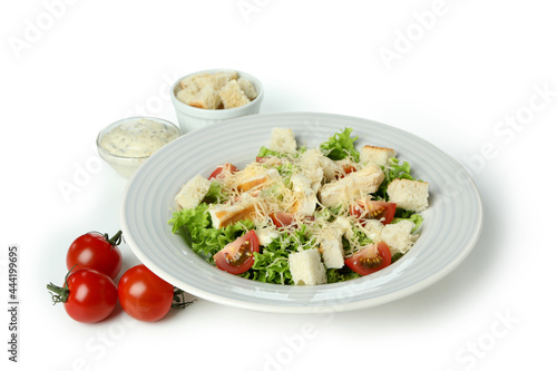 Plate with Caesar salad isolated on white background