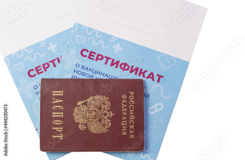 Close-up of the Russian passport and two certificates of vaccination are isolated on a white background