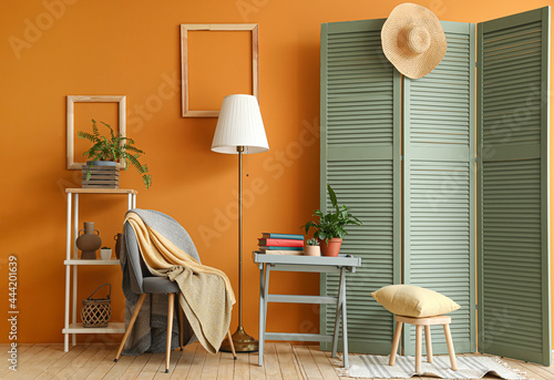 Interior of stylish room with folding screen photo