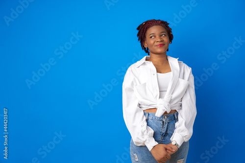 Thoughtful young african american female portrait against blue background