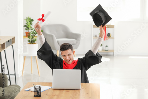 Happy male student on his g...