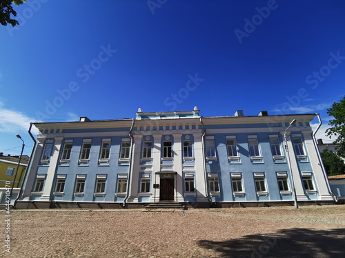 The two-storey blue Palace of the vicar (now it has a diocesan administration) on a sunny summer day in Vyborg. photo