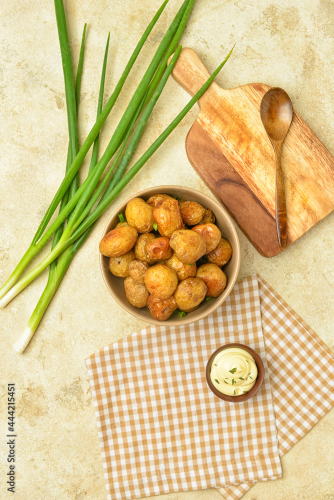 Composition with tasty baked potato and sauce on light background Composition with tasty baked potato and sauce on light background