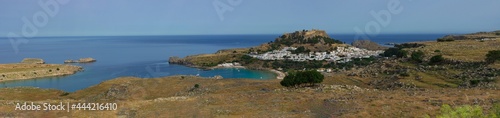 Beautiful panorama of the ancient city and acropolis of Lindos on the Mediterranean coast (Rhodes, Greece)