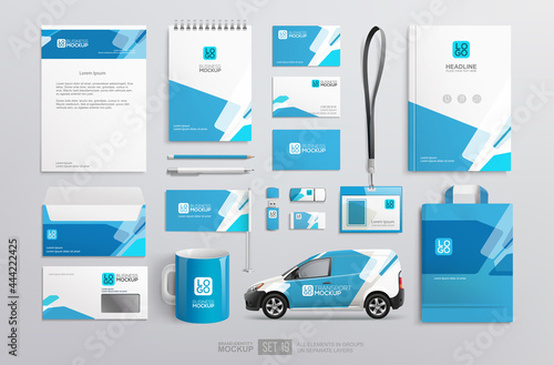 Stationery Brand Identity Mockup set with blue and white abstract geometric design.  Business stationary mockup template of Guide, annual report cover, van, brochure, bag, corporate mug photo