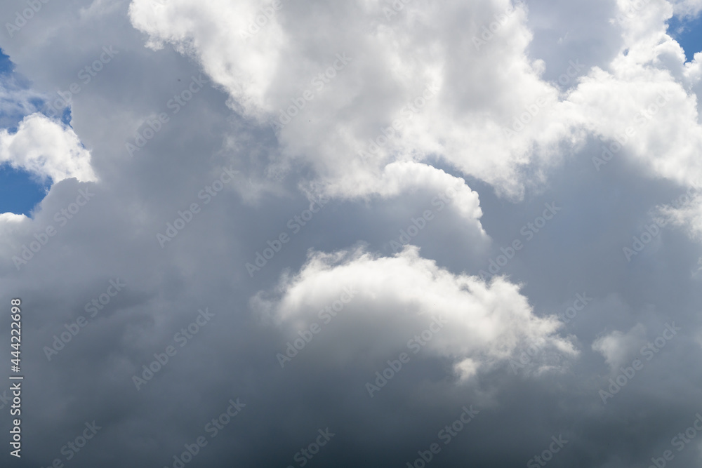Sky background with grey cloud formation and sunshine Sky background with grey cloud formation and sunshine