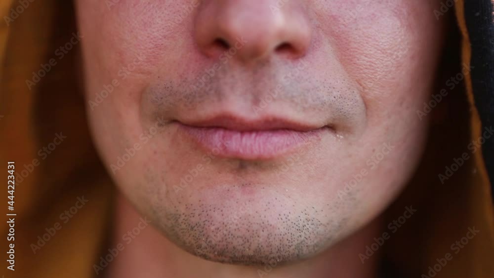 Yellow damaged tooth of smiling Caucasian man in the hood close-up. Focus on the teeth, open mouth. Dental problems, dead teeth, enamel whitening, aesthetic restoration. Natural enamel, body positive Yellow damaged tooth of smiling Caucasian man in the hood close-up. Focus on the teeth, open mouth. Dental problems, dead teeth, enamel whitening, aesthetic restoration. Natural enamel, body positive