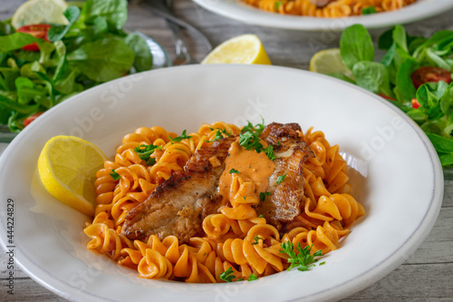 Pasta with fish and creamy tomato sauce