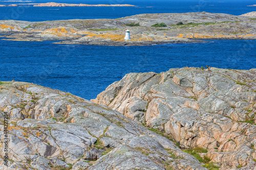 Rocky archipelago with a lighthouse photo