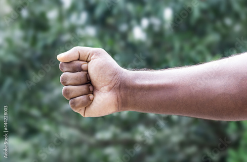 Men strong fist hand stretching toward close up © Xookits