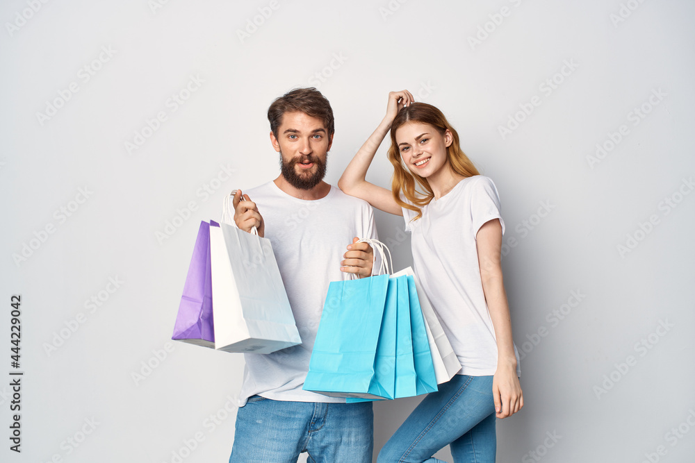 young couple with bags in hand shopping sale fun young couple with bags in hand shopping sale fun