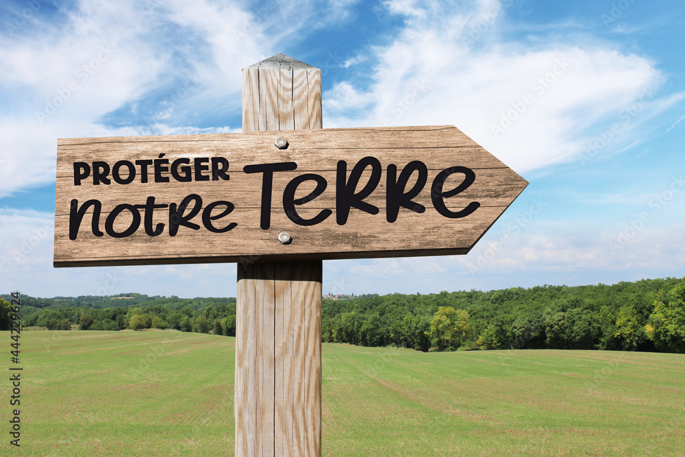 Jour de la Terre, aimer et protéger notre planète, panneau en bois dans paysage nature et campagne